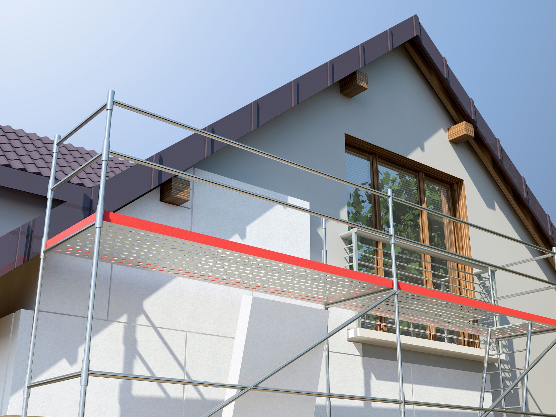 Ein Haus wird umgebaut und an der Seite steht ein Gerüst.