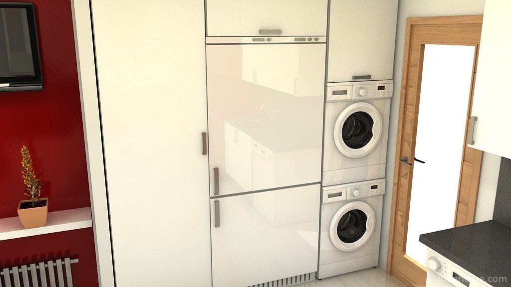 Una cocina con una lavadora y una secadora apiladas una encima de la otra