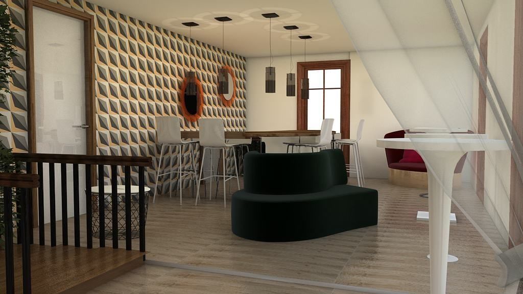 Una sala de estar con un sofá negro y una mesa blanca.
