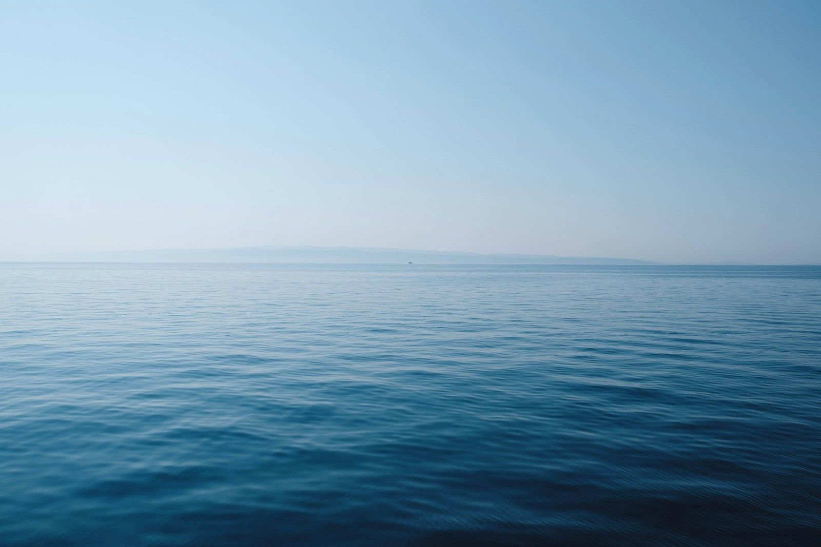 a calm, still sea symbolising a regulated nervous system and emotional balance in neurodivergent people