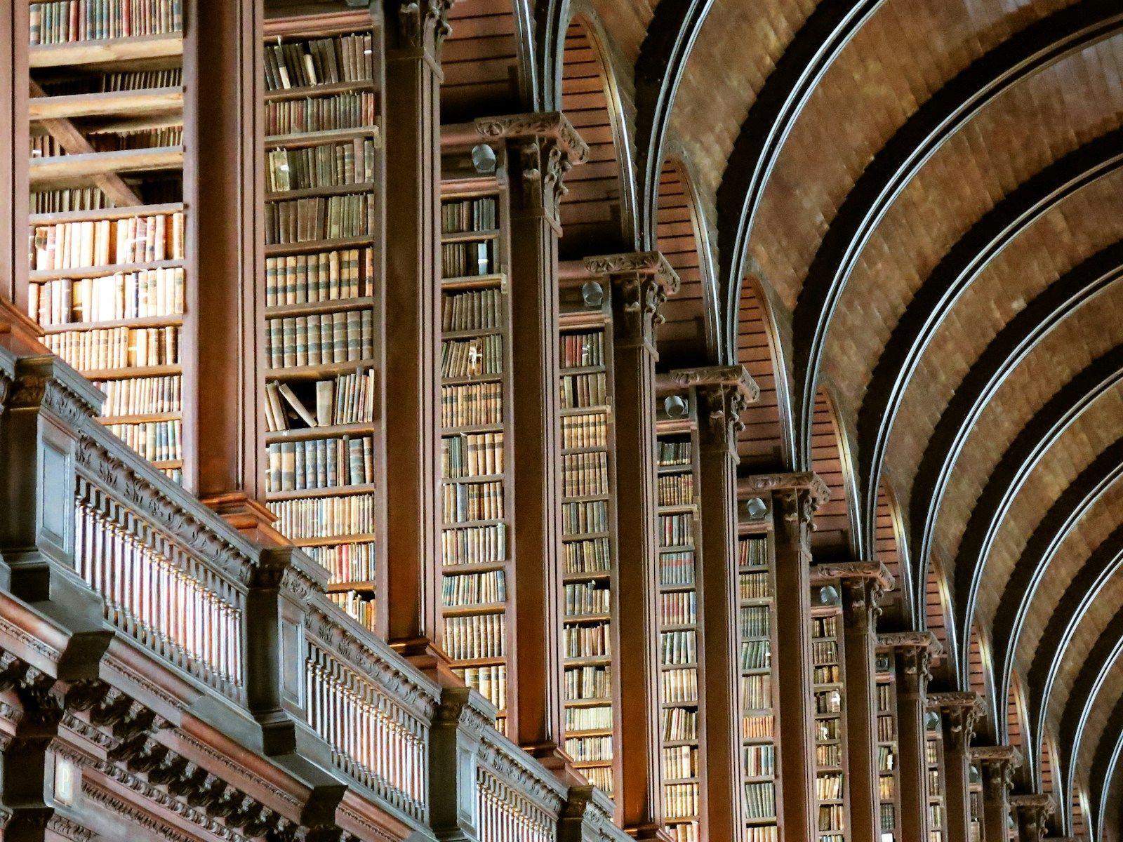 old library with rows of books, symbolising the deep history and research behind rethinking ADHD