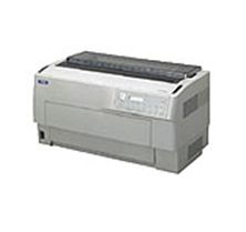 Una impresora blanca está colocada encima de una mesa blanca.