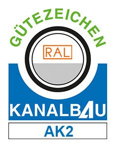 RAL Gütezeichen Kanalbau AK2 Logo mit blau-weiß-grün-schwarzem kreisförmigem Emblem