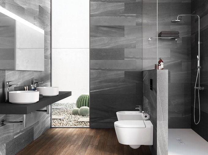Un baño con dos lavabos, un inodoro y una ducha.