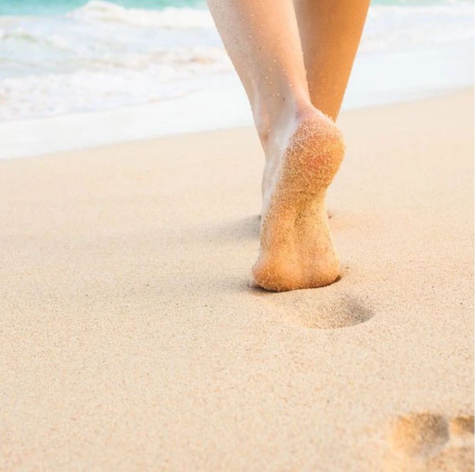 Fußpflegestudio, Füße in Sand