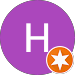 Um círculo roxo com a letra h e uma estrela laranja dentro dele.