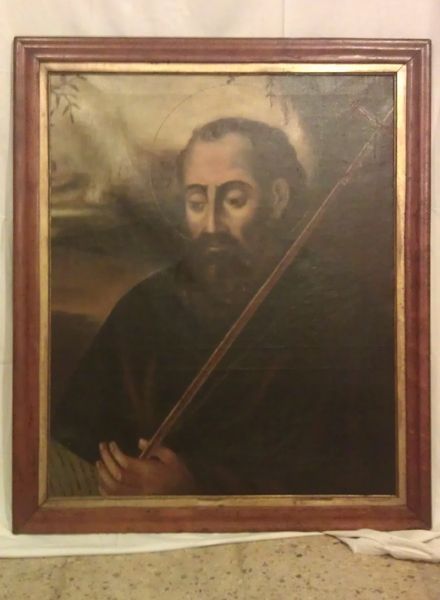 Un cuadro enmarcado de un hombre con barba sosteniendo un violín.