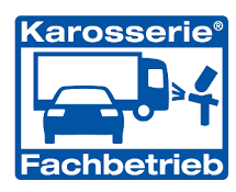 A blue and white sign that says karosserie fachbetrieb