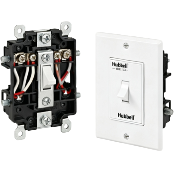 Black square light switch on a beige wall.