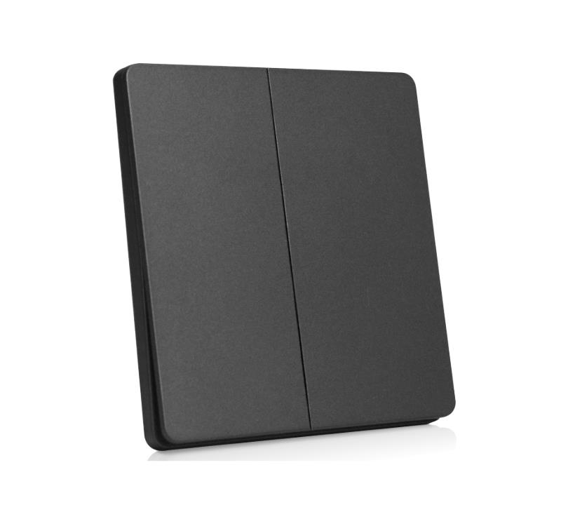 Black wall-mounted touchscreen with gold trim, mounted on a grey wall.