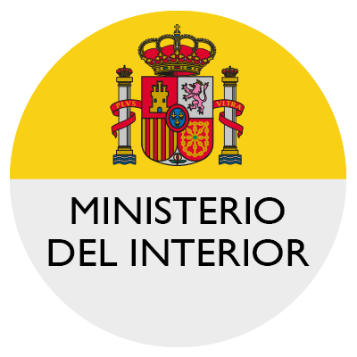 Logotipo del Ministerio del Interior español con escudo de armas sobre fondo circular amarillo y blanco.