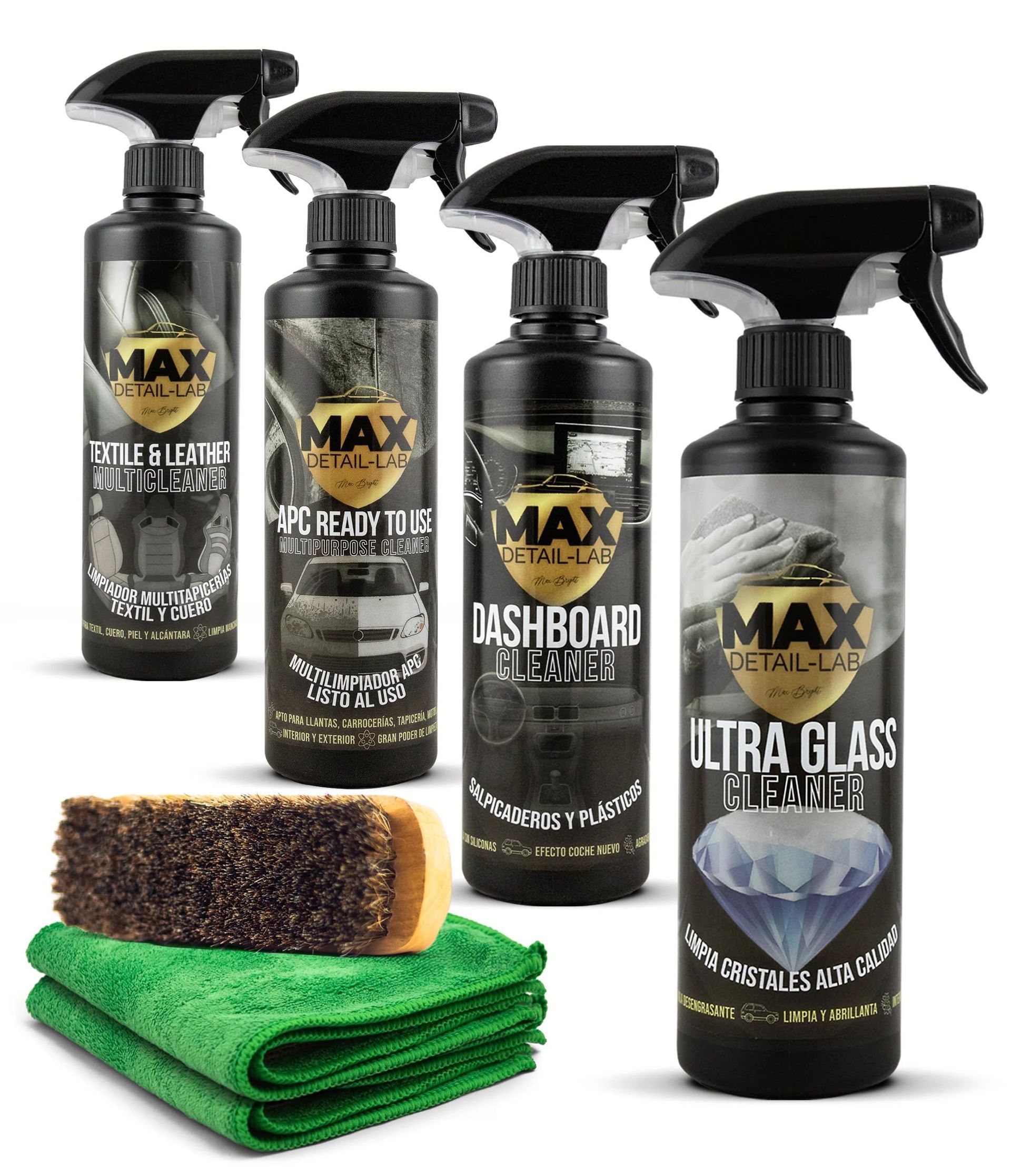 Cuatro botellas de spray negras con la etiqueta 