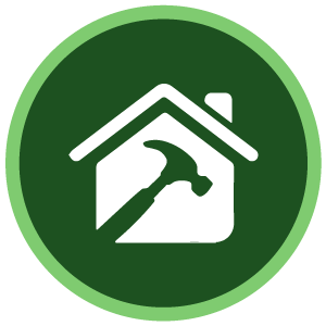 Icono circular verde de una casa blanca con un martillo en su interior