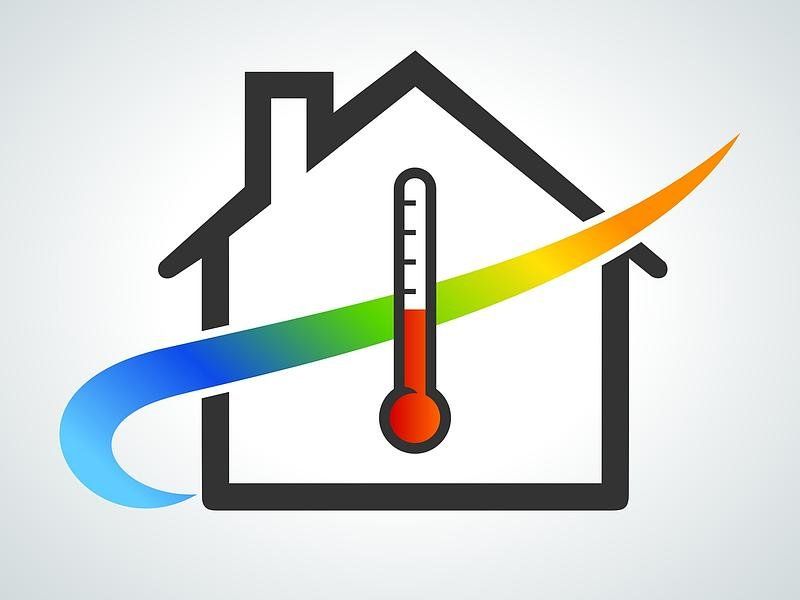 Maison avec un thermomètre en premier plan