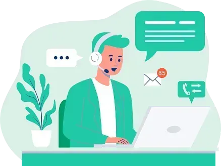 Un hombre que lleva auriculares y cascos está sentado delante de una computadora portátil.