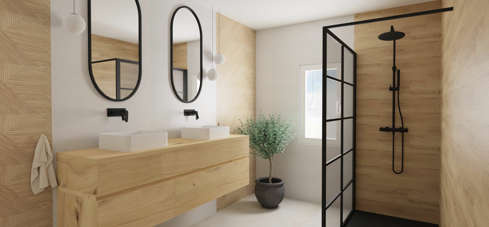 Baño moderno con tocador de madera, espejos ovalados, ducha con marco negro y una planta en maceta.
