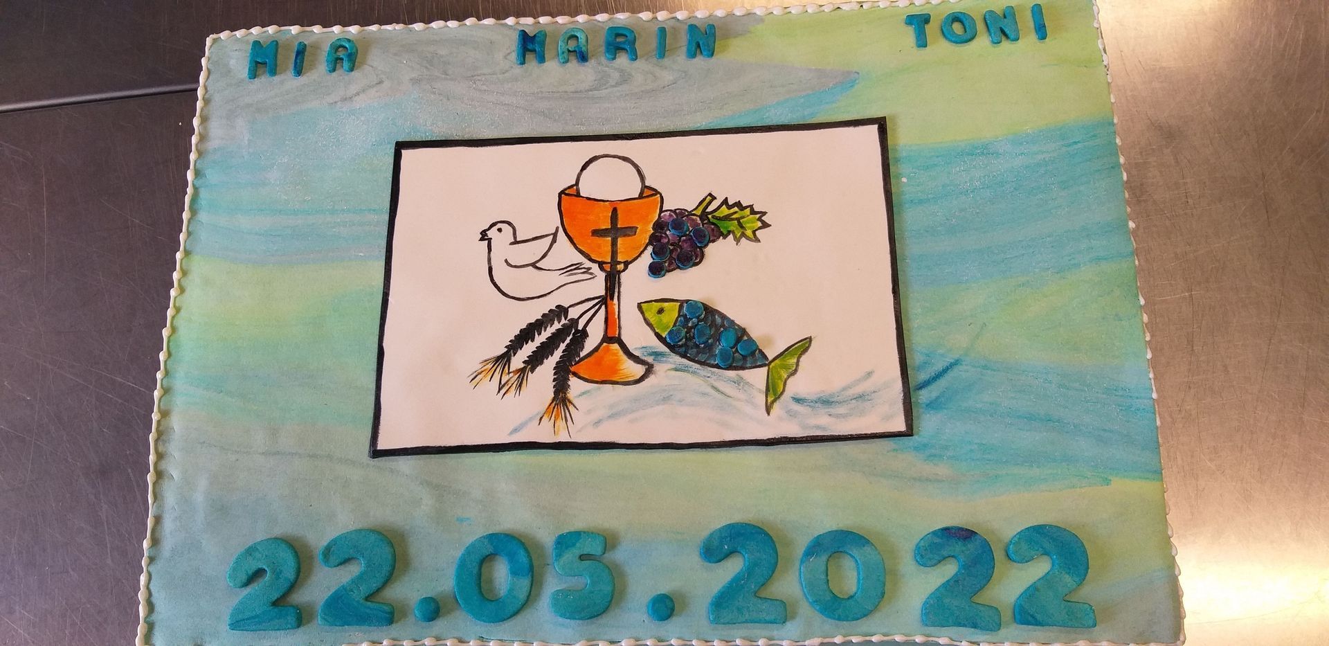 Ein Kuchen mit einem Bild von Jesus und dem Datum 22.03.2022