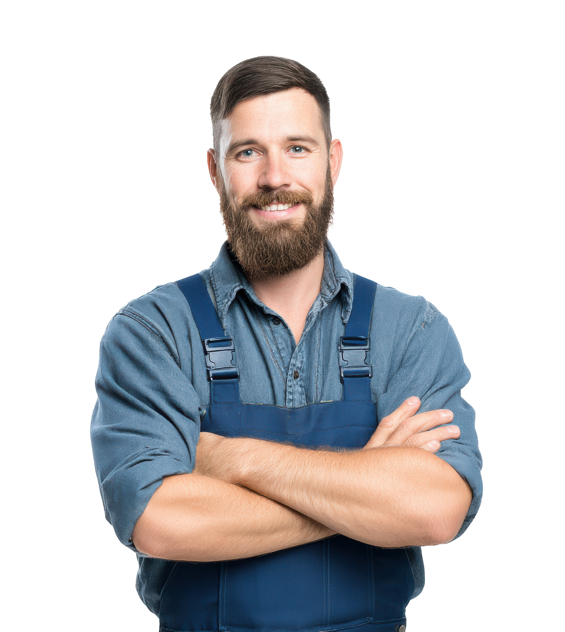 Homme avec une barbe portant une salopette bleue, les bras croisés, souriant.