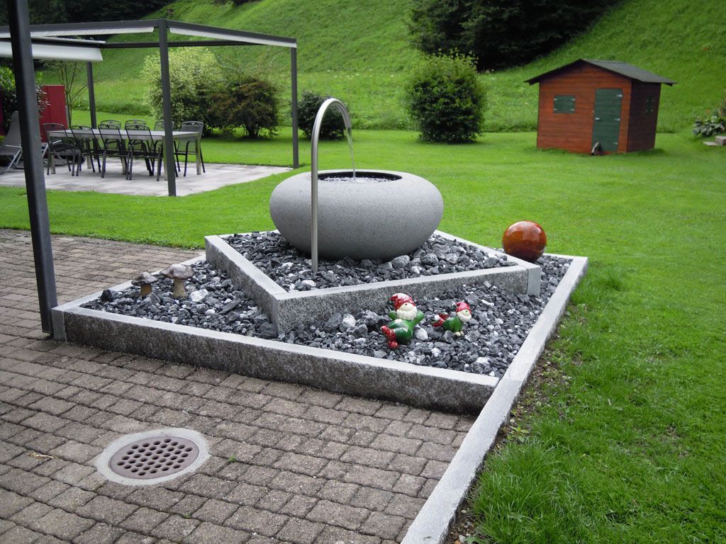 Natursteinbrunnen - Hadorn Gartenbau