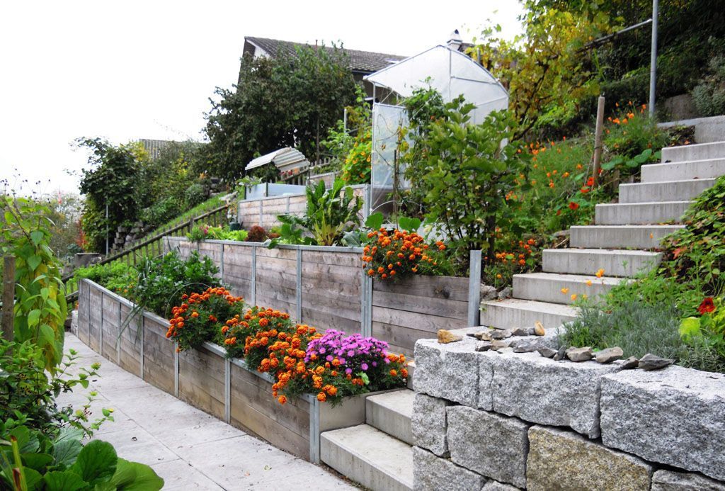 Böschungsverbauung mit 20er Quader und Hochbeet - Hadorn Gartenbau