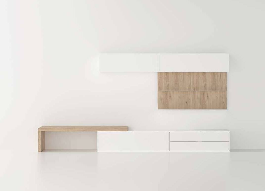 Un centro de entretenimiento blanco y de madera en una sala de estar con una pared blanca.