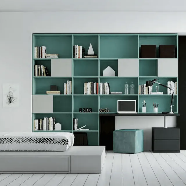 Un dormitorio con una cama, un escritorio, estanterías y una computadora portátil.