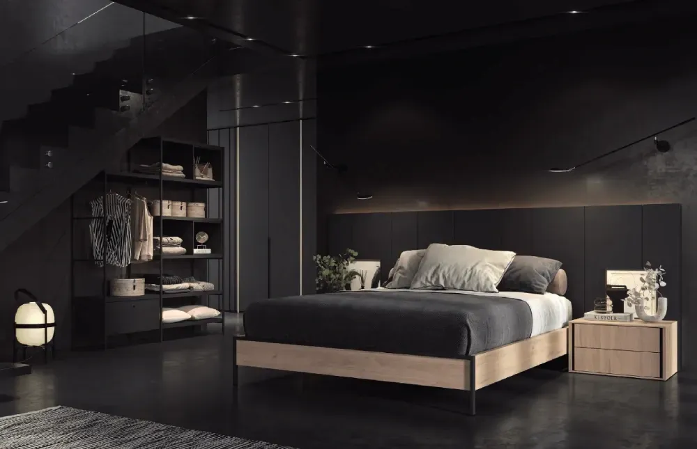 Un dormitorio con una cama, mesita de noche y armario.