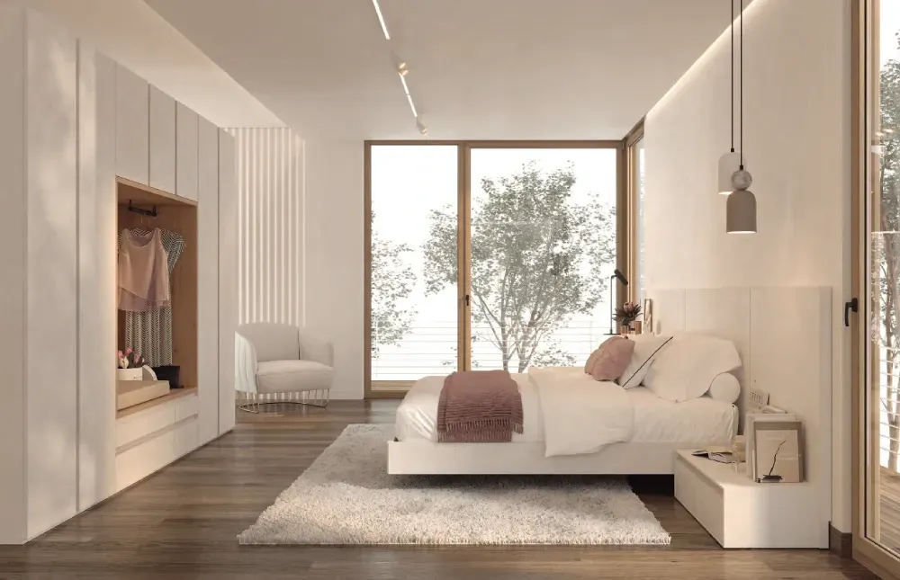 Un dormitorio con una cama grande y una ventana grande.