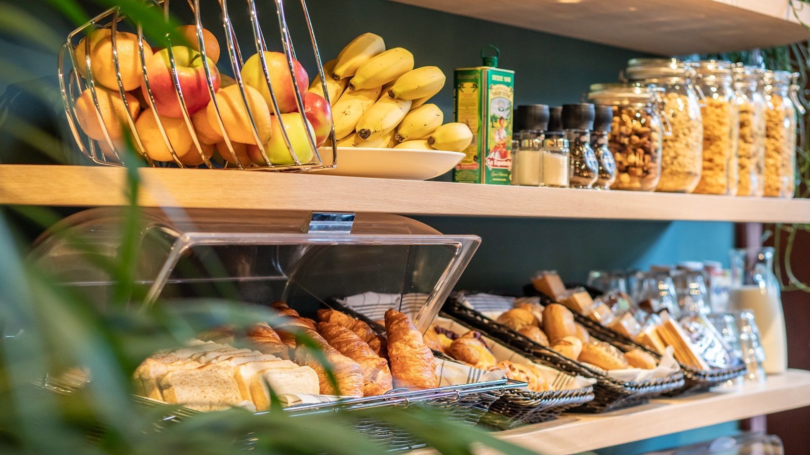 There are many different types of food on the shelves.