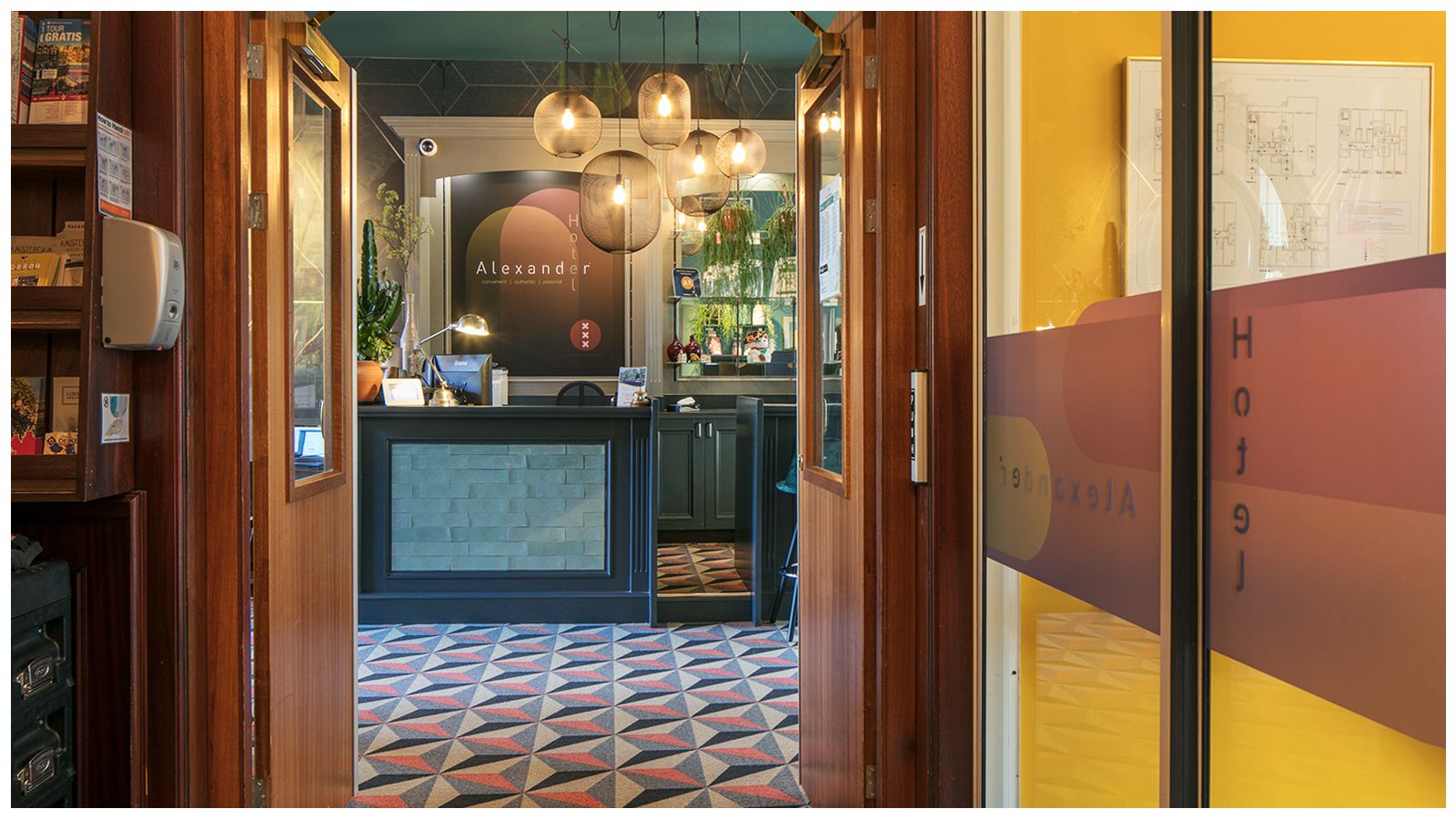 A hotel lobby with a reception desk and a bar.