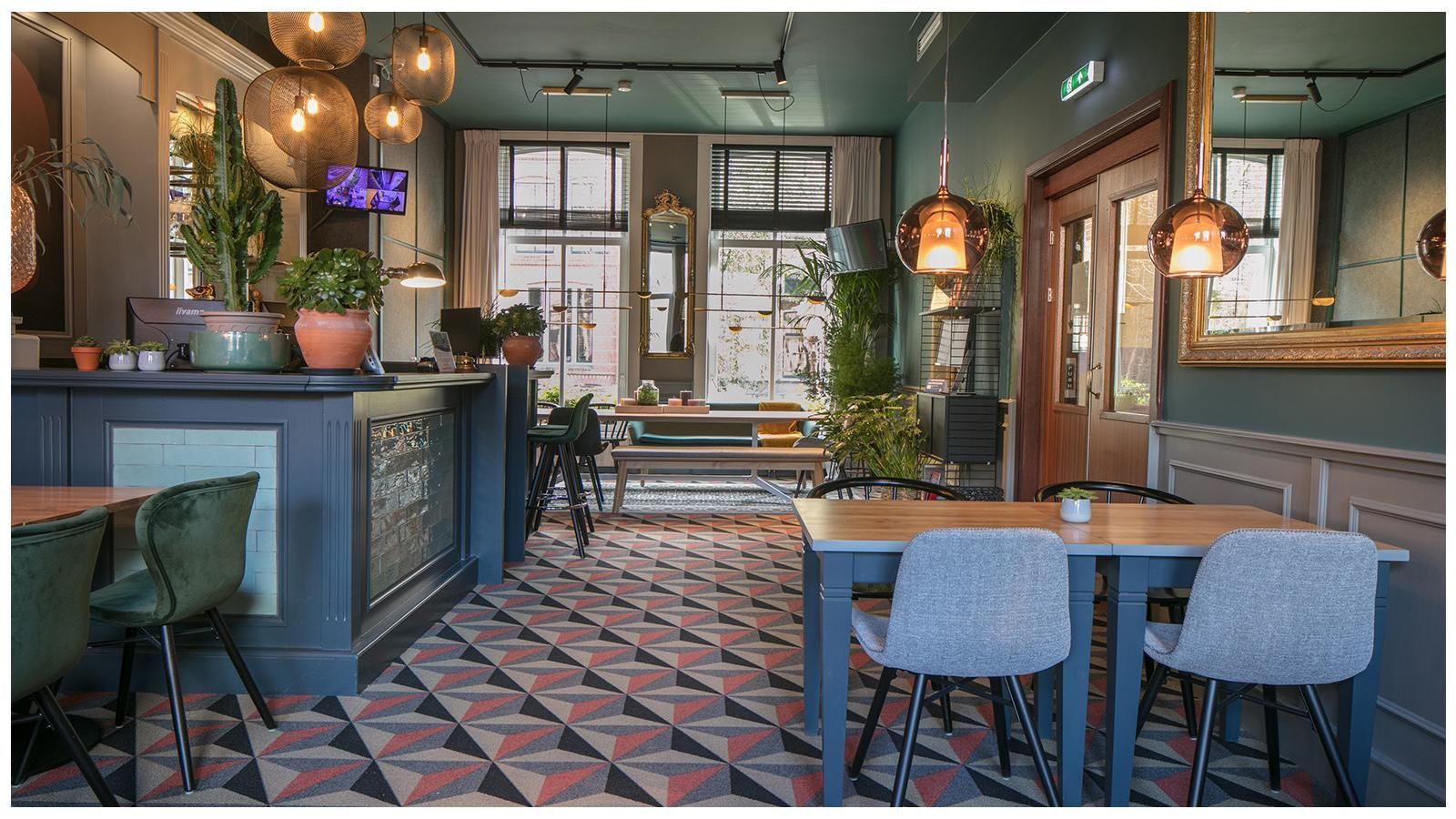 A restaurant with tables and chairs and a tiled floor.