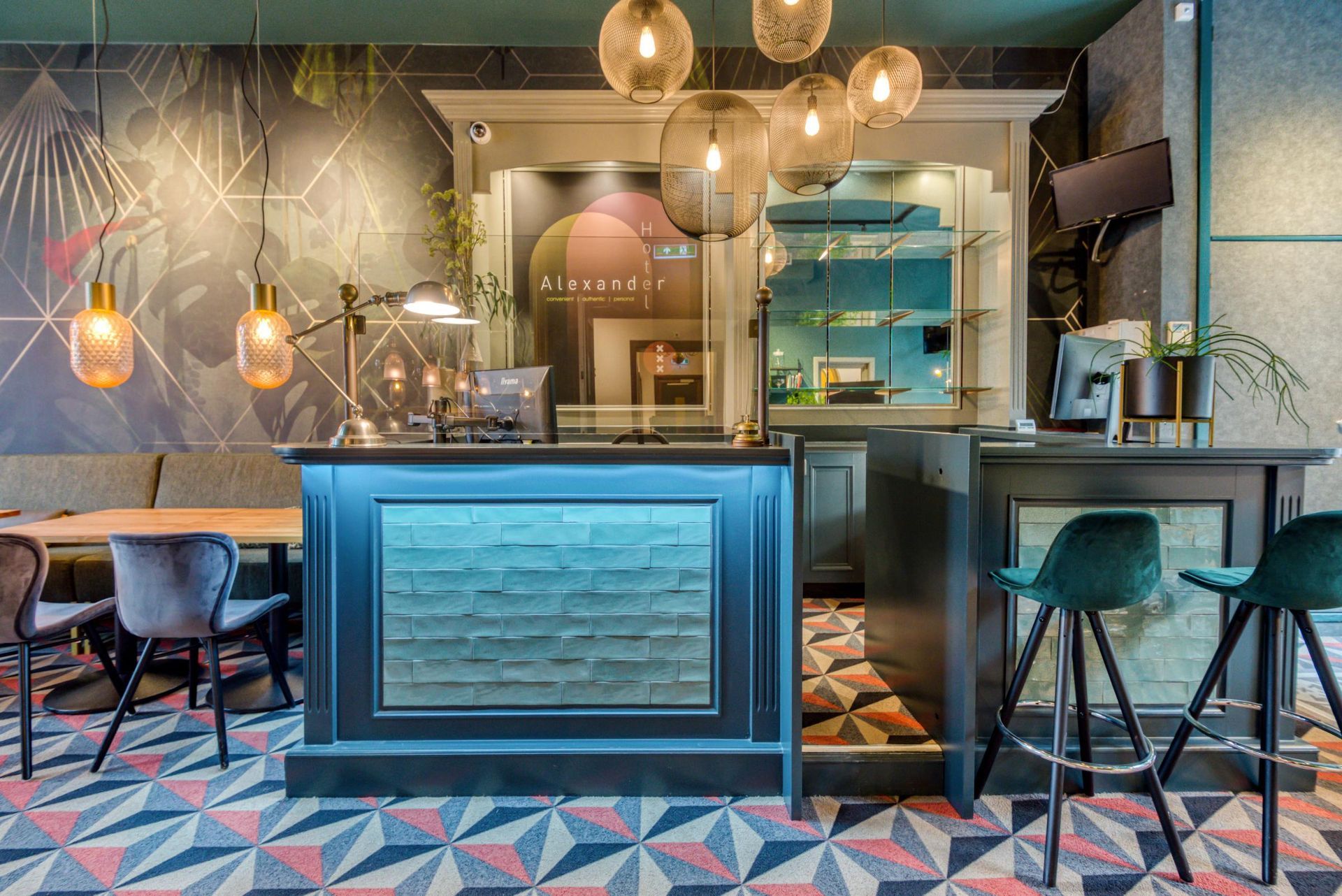A restaurant with a bar , tables and chairs.