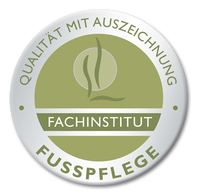 A white badge with green text: