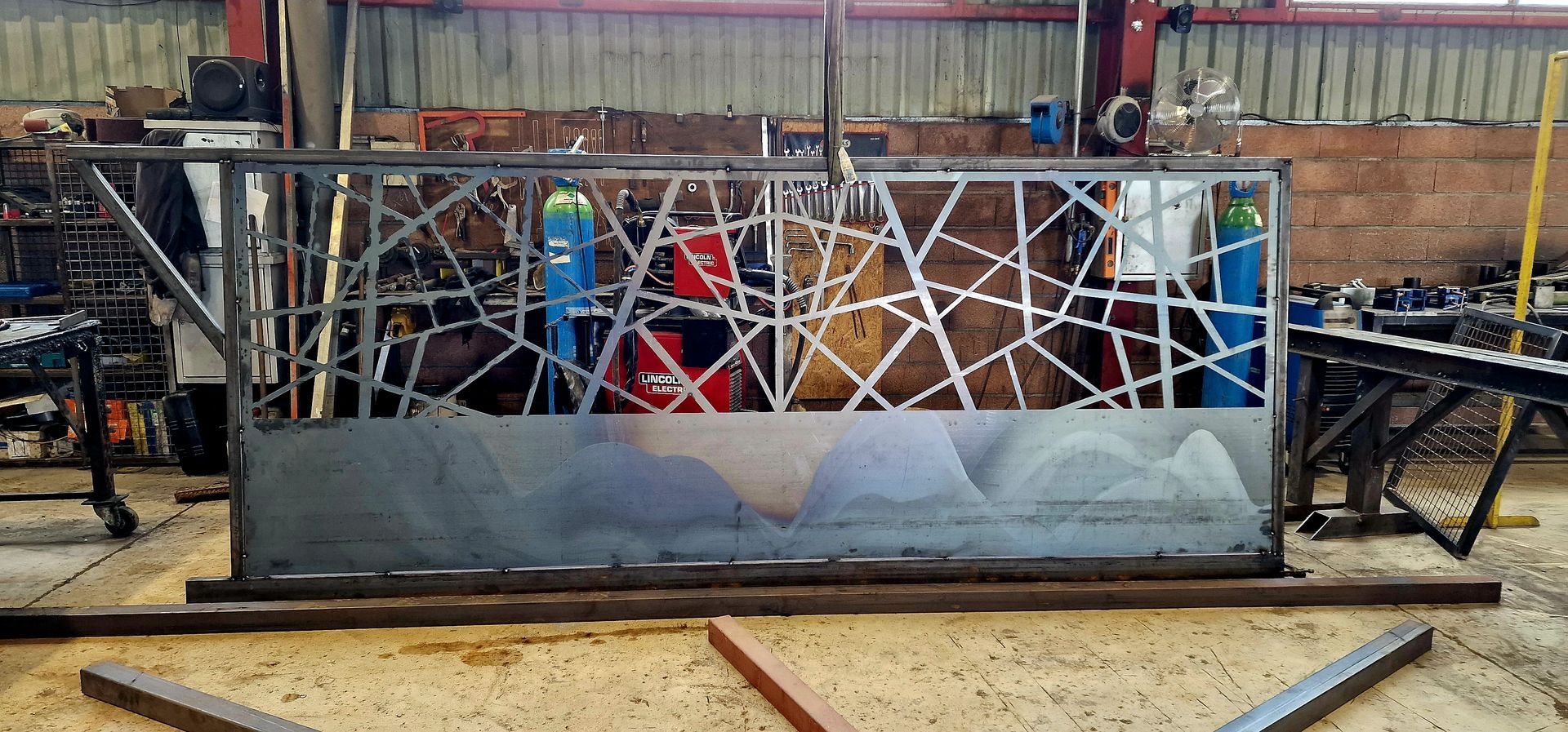 Portail ouvragé dans un atelier pour un particulier