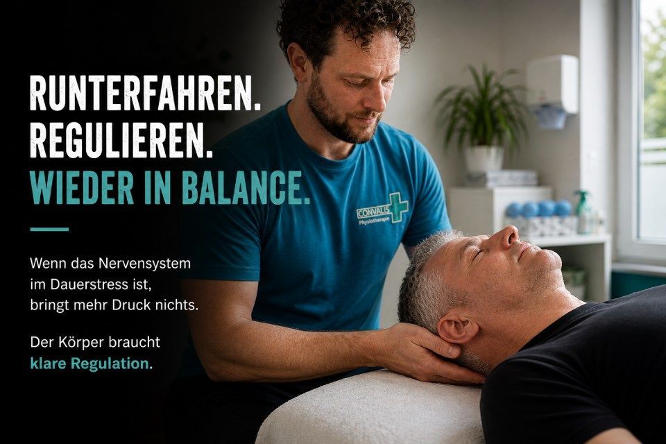 Therapist in blue shirt massages a reclining patient in a bright clinic.