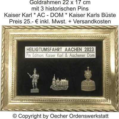 Goldgerahmtes Display: drei Pins (Kaiser Karl, Aachener Dom, Büste) der Aachener Wallfahrt 2023.