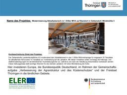 Bauarbeiten in einer Scheune mit Text zur europäischen Förderung.