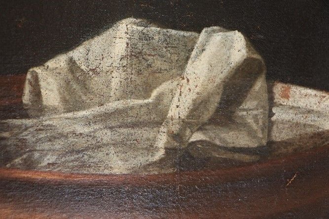 Tableau d'un chiffon blanc dans un bol avant restauration.