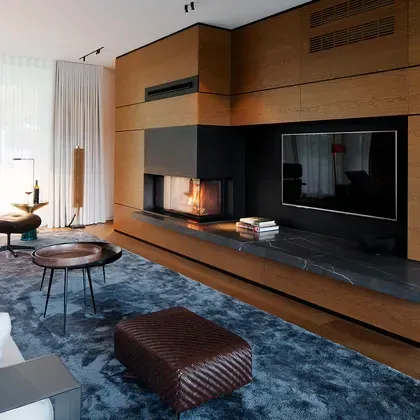 Ein exklusives Wohnzimmer mit einer großflächigen Holzverkleidung
