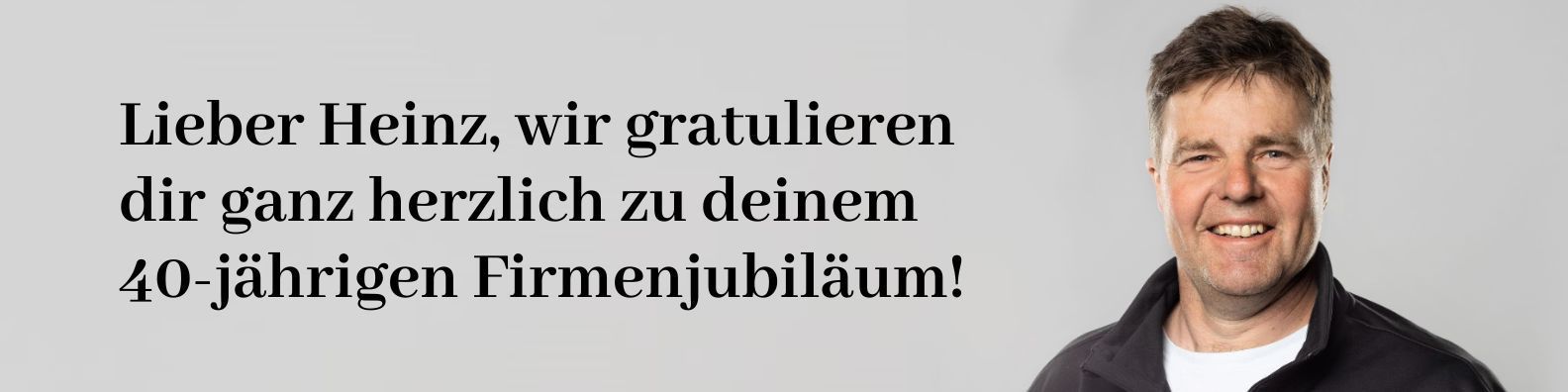 Textbild mit deutschem Glückwunsch: „Lieber Heinz, wir gratulieren dir ganz herzlich zu deinem 40-jährigen Firmenjubiläum!“