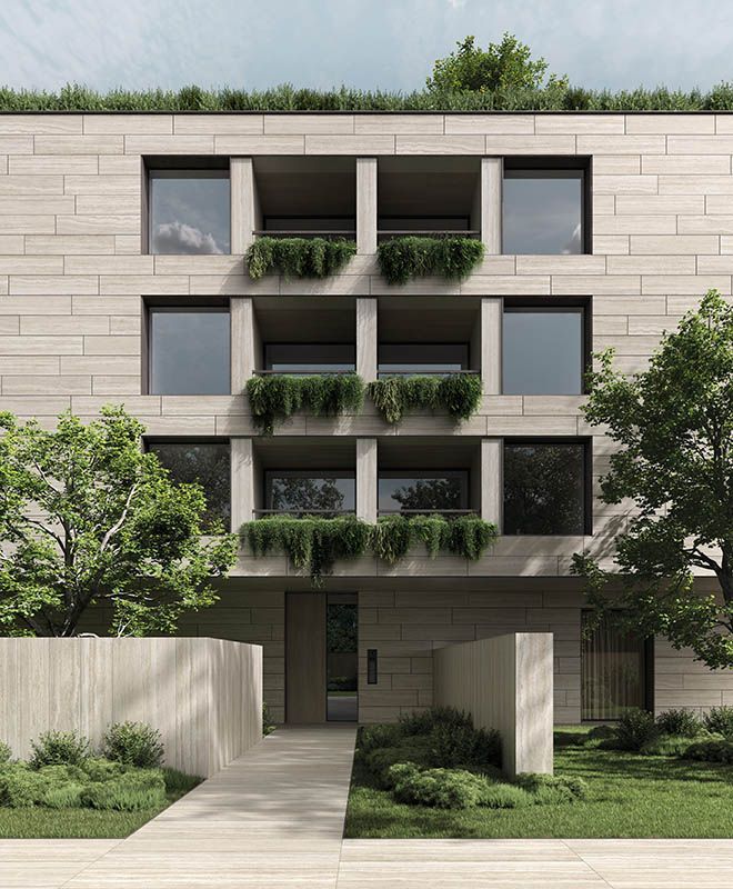 Immeuble d'appartements moderne beige avec balcons et verdure, précédé d'une allée et d'une entrée paysagée