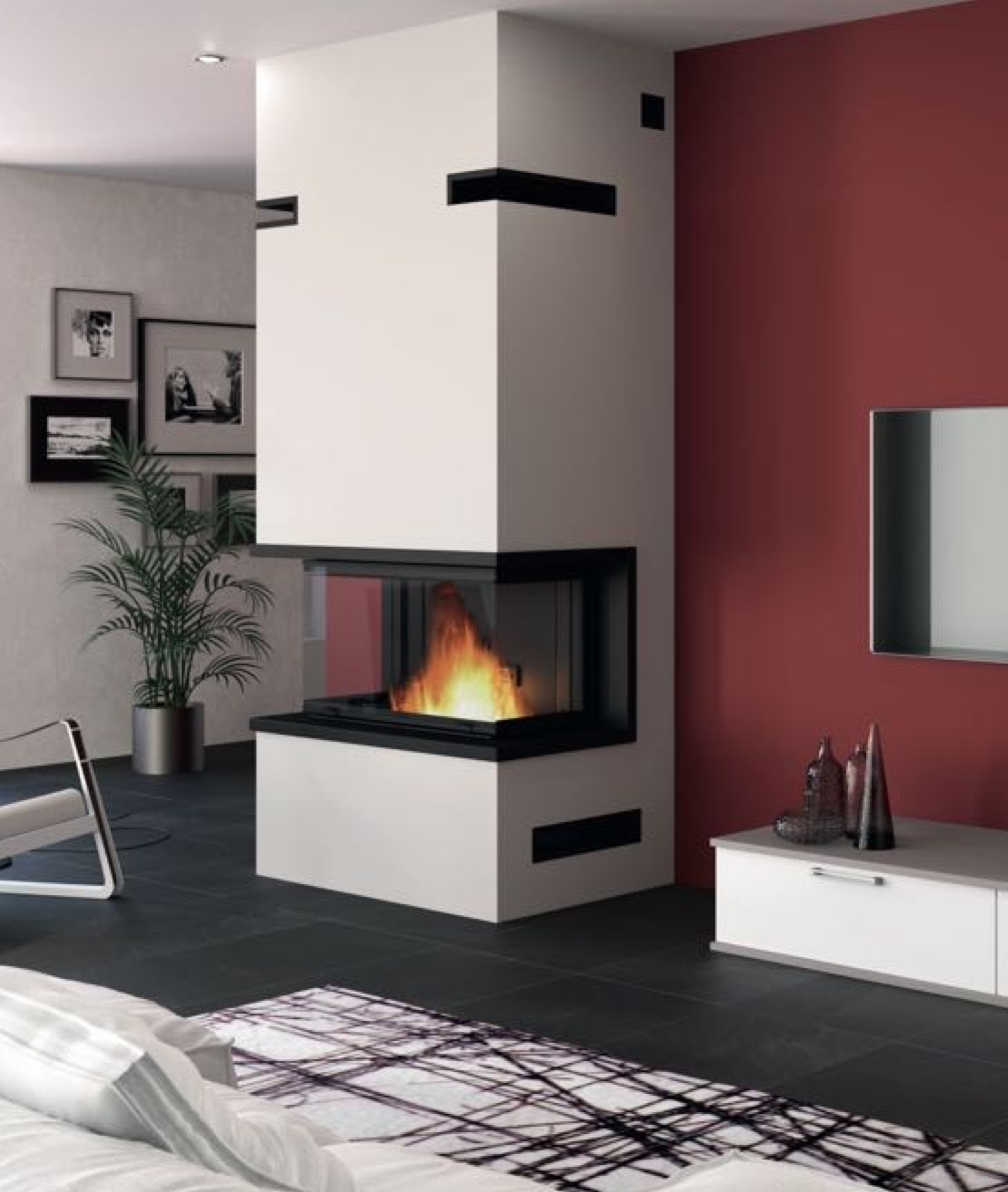 Cheminée d'angle blanche moderne avec façade en verre, feu qui brûle, dans un salon avec un mur d'accent rouge.