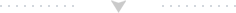 Barre horizontale gris clair avec un triangle centré pointant vers le bas et de petits points le long du bord supérieur