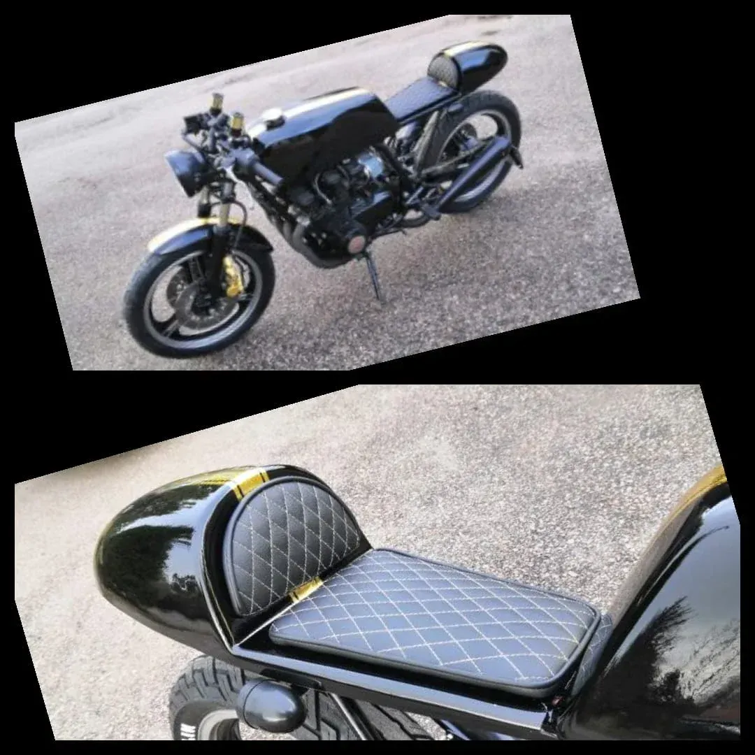 Musta custom-moottoripyörä mustilla ja keltaisilla yksityiskohdilla sekä lähikuva tikatusta istuimesta ja takakonepellistä.