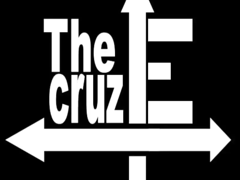 Logotipo en blanco y negro con la inscripción “The Cruz”, una gran letra E y una flecha horizontal de doble punta debajo.