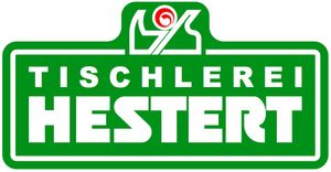 Ein grünes Schild mit der Aufschrift Tischlerei Hestert