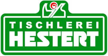 Ein grünes Schild mit der Aufschrift Tischlerei Hestert
