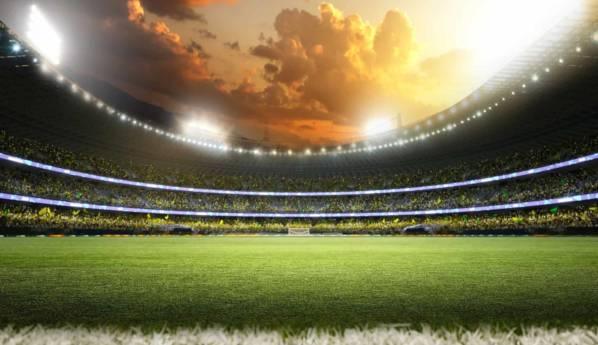 Un estadio de fútbol vacío con una multitud de personas viendo un partido.