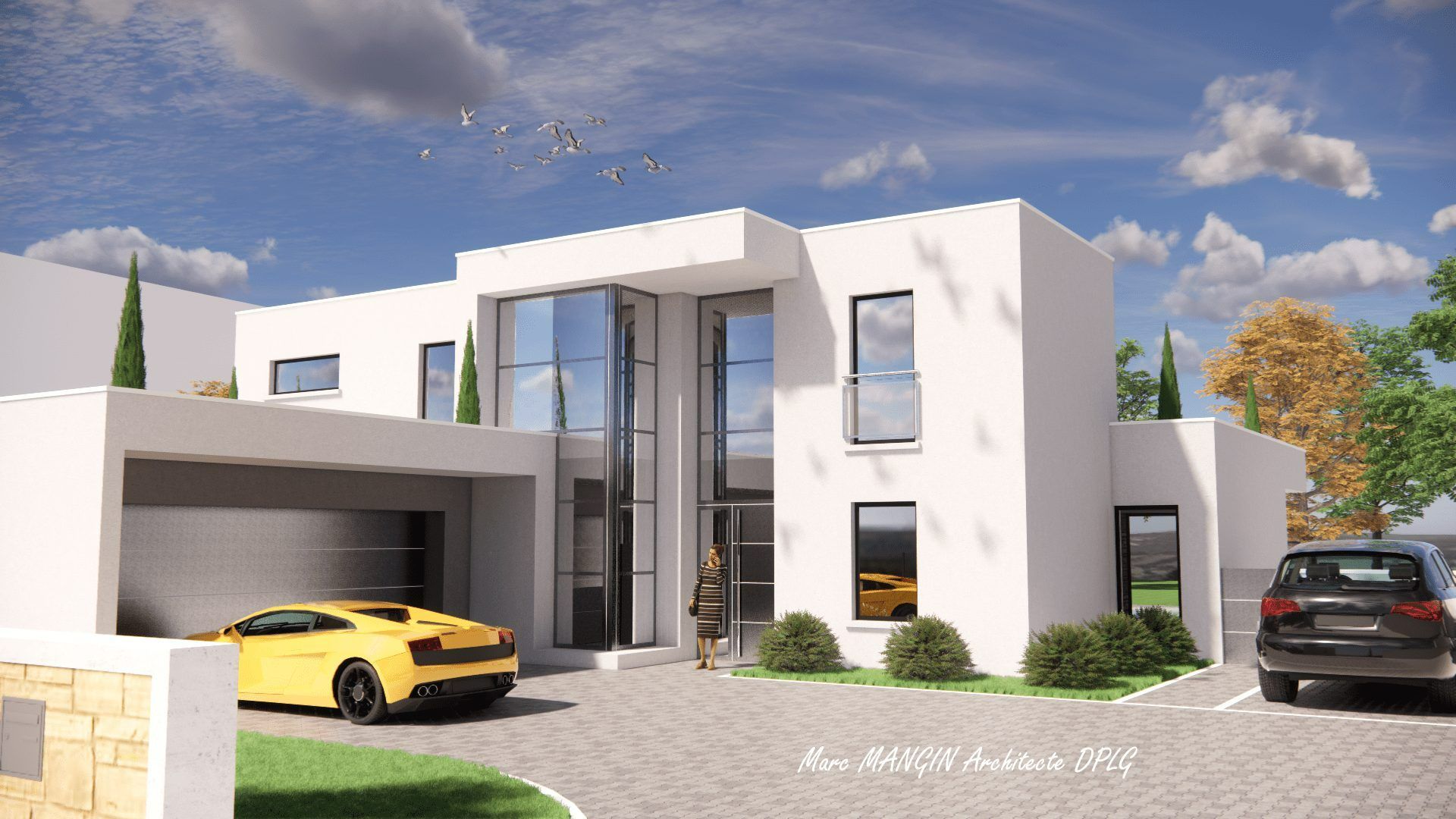 Maison blanche avec voitures
