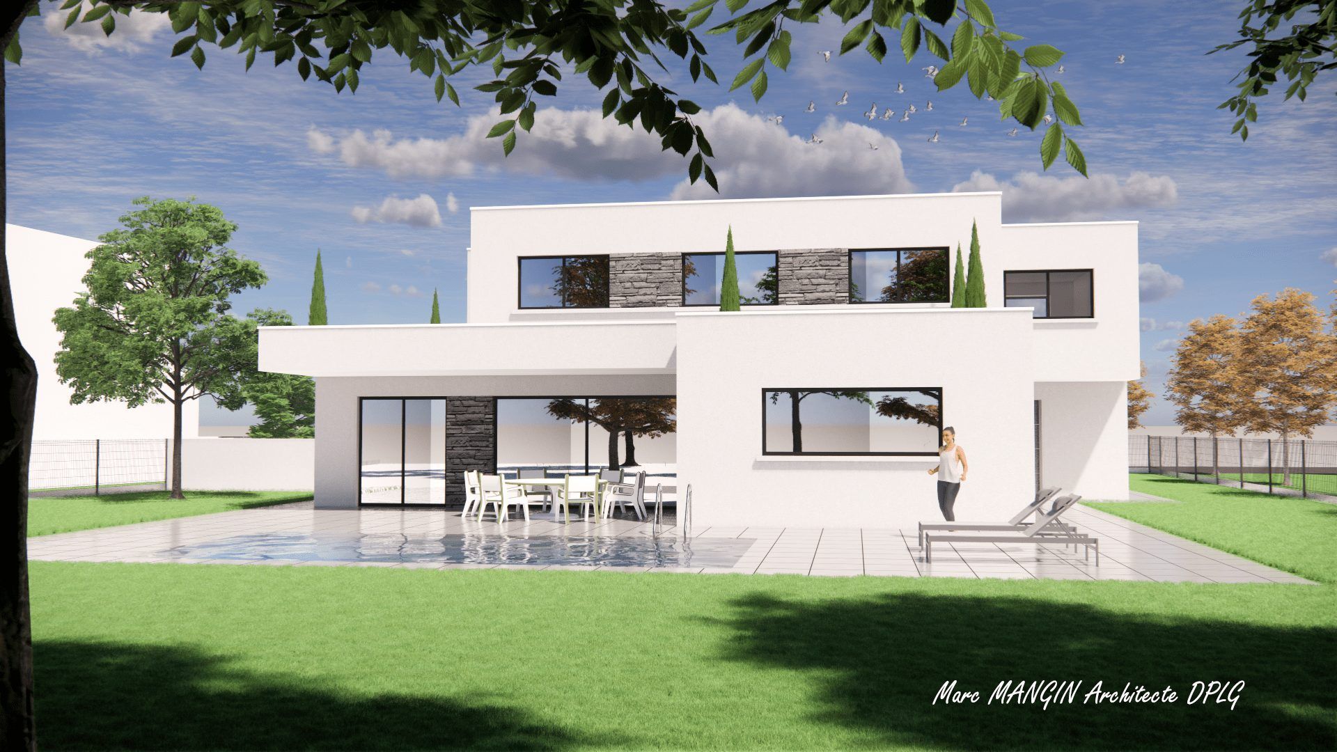 Maison blanche avec herbe verte